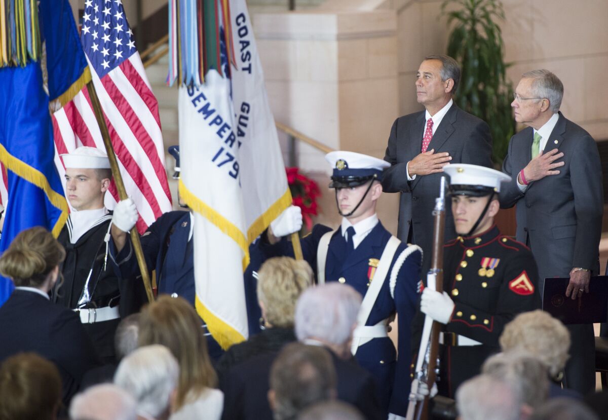 House Speaker John A. Boehner of Ohio, left, and Senate Majority Leader Harry Reid of Nevada attend the Congressional Gold Medal ceremony at the Capitol in Washington on Wednesday.