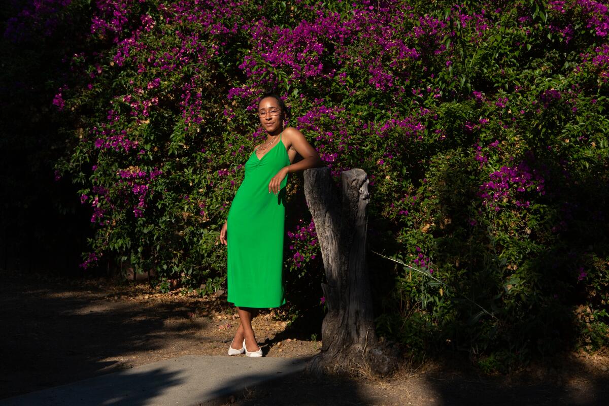 Jamesa Hawthorne, an herbalist, poses at their home in Eagle Rock. (Gabriella Angotti-Jones / Los Angeles Times)