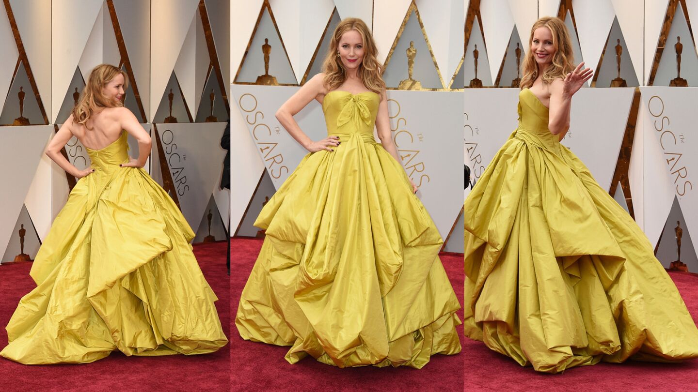 Is that Belle from “Beauty and the Beast?” No it's her Oscars 2017 doppelganger -- actress Leslie Mann, who shines in a yellow Zac Posen dress, Lorraine Schwartz jewelry and Jimmy Choo clutch and shoes. On anyone else at any other time we might feel differently, but here she's our guest on the best-dressed list.