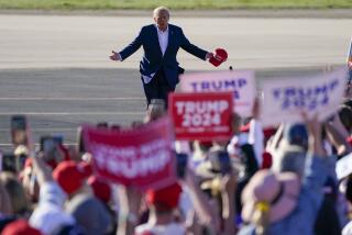 Former President Donald Trump walks across the tarmac as he arrives to speak at a campaign rally at Waco Regional Airport Saturday, March 25, 2023, in Waco, Texas. (AP Photo/Nathan Howard)