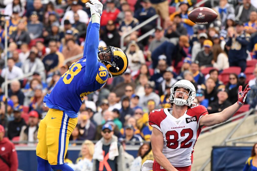 LOS ANGELES, CALIFORNIA DECEMBER 29, 2019-Rams linebacker Travin Howard deflects a pass in the end zone intended for Cardinlas tight end Dan Arnold in the 2nd quarter at the Coliseum Sunday. (Wally Skalij/Los Angerles Times)