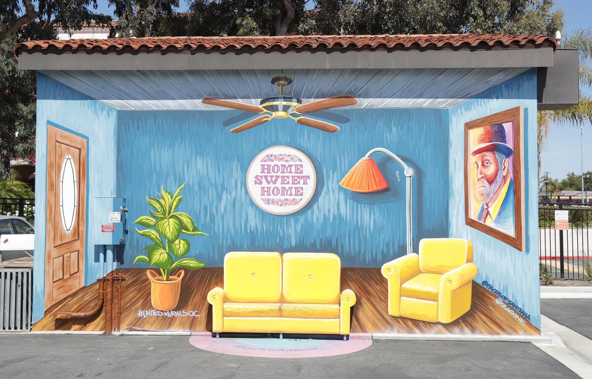 "Home Sweet Home," painted on a storage facility on 19th St. by artist Zaoone, is one of many colorful murals in Costa Mesa. 