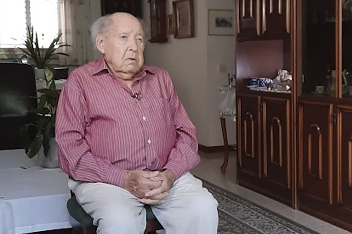 This undated photo provided by Yad Vashem Holocaust Memorial shows Shlomo Perel at his home in Givatayim, Israel. Perel, who survived the Holocaust through surreal subterfuge and an extraordinary odyssey that inspired his own writing and an internationally renowned film, has died. He was 98. (Yad Vashem Holocaust Memorial via AP)