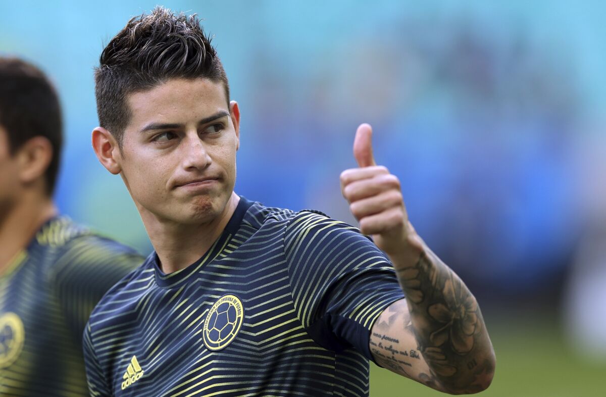 FILE - In this Sunday, June 23, 2019 file photo, Colombia's James Rodriguez gives a thumbs up before a Copa America Group B soccer match against Paraguay at Arena Fonte Nova in Salvador, Brazil. James Rodriguez joined Premier League club Everton on Monday, Sept. 7, 2020 in an attempt to revive a career that faltered at Real Madrid. Signed by the Spanish giants after capturing world football with a stunning goal for Colombia at the 2014 World Cup, Rodriguez couldn’t match those highs in Madrid. (AP Photo/Ricardo Mazalan, file)
