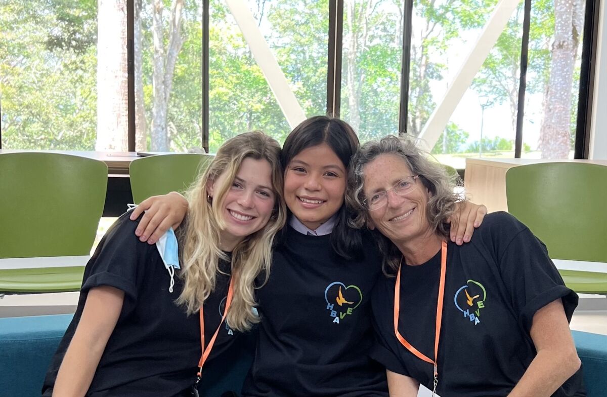 Caroline and Ellen Sullivan with Tatiana (center), an eighth grader at EVA.