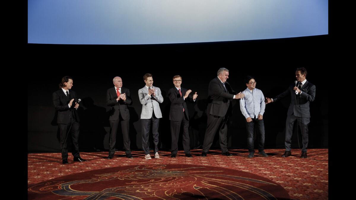 Actor and producer Mark Wahlberg, far left, and director Peter Berg, far right, introduce some of the real people from the 2013 Boston Marathon bombing.