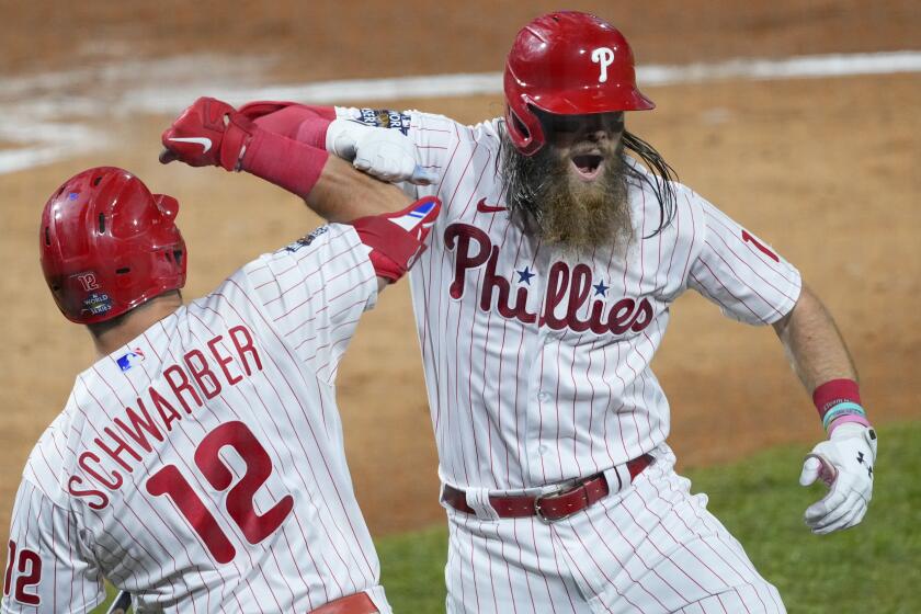 Philadelphia Phillies' Brandon Marsh celebrates his home run during the second inning in Game 3.