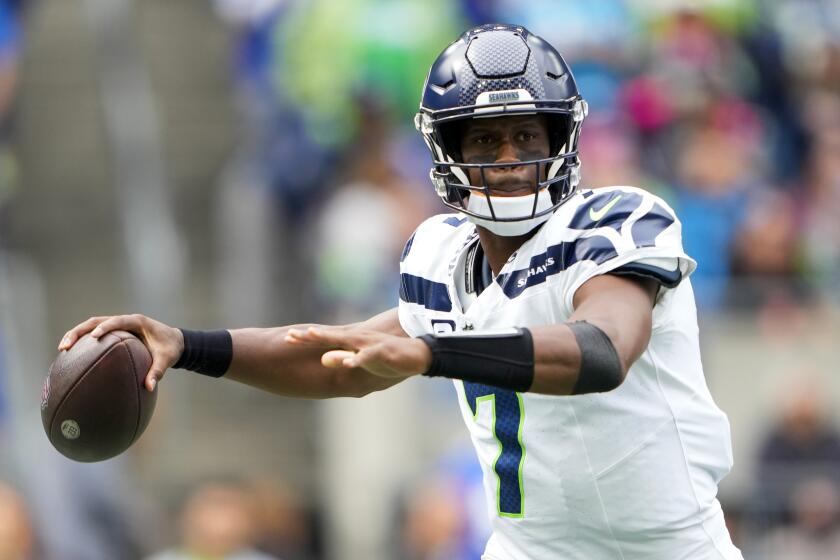 Seattle Seahawks quarterback Geno Smith passes against the Carolina Panthers during the first half of an NFL football game Sunday, Sept. 24, 2023, in Seattle. (AP Photo/Lindsey Wasson)