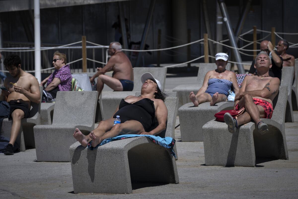 Sunbathers near a beach in Barcelona, Spain.