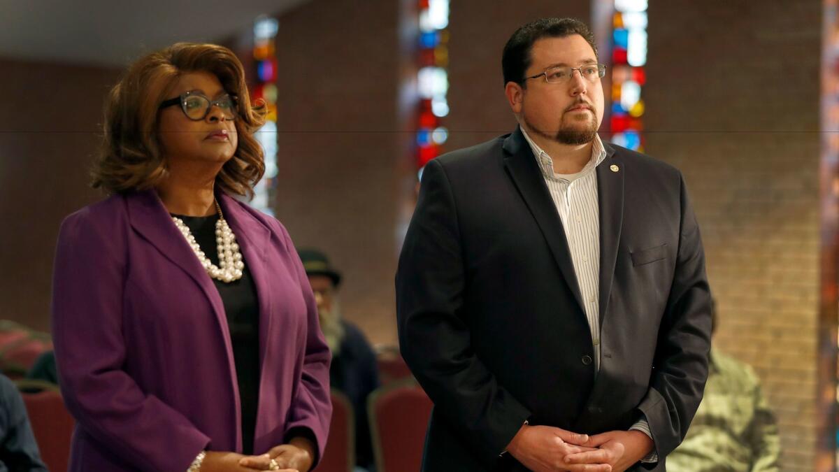 Mayor James Knowles III and his opponent, Councilwoman Ella Jones, at a March 30 mayoral forum in Ferguson, Mo.