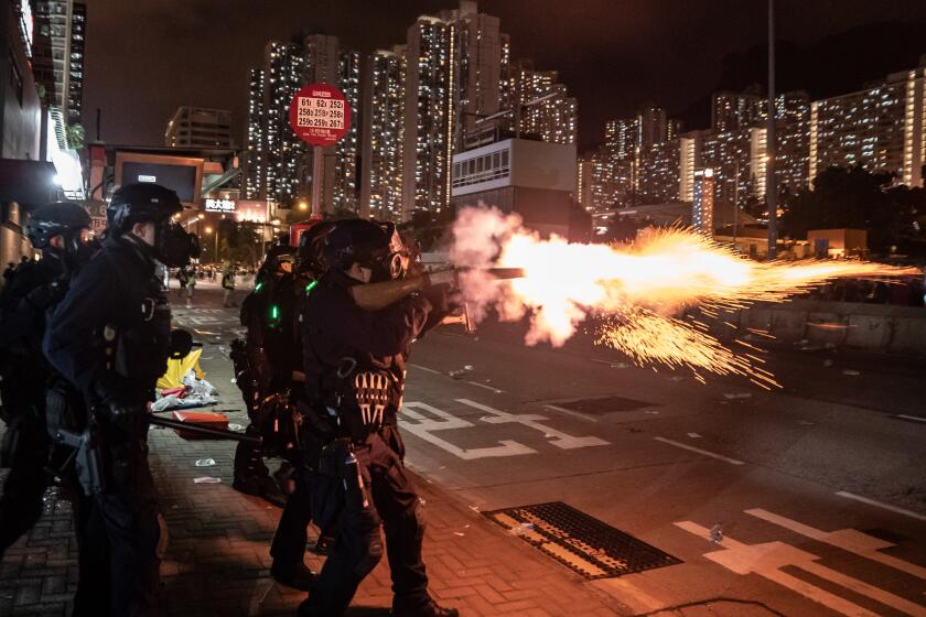 HONG KONG, CHINA - AUGUST 5: Riot police fire tear gas at protesters during a demonstration in Wong Tai Sin District on August 5, 2019 in Hong Kong, China. Pro-democracy protesters have continued rallies on the streets of Hong Kong against a controversial extradition bill since 9 June as the city plunged into crisis after waves of demonstrations and several violent clashes. Hong Kong's Chief Executive Carrie Lam apologized for introducing the bill and declared it "dead", however protesters have continued to draw large crowds with demands for Lam's resignation and completely withdraw the bill. (Photo by Anthony Kwan/Getty Images) ** OUTS - ELSENT, FPG, CM - OUTS * NM, PH, VA if sourced by CT, LA or MoD **