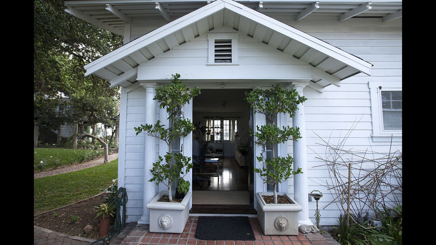 A covered front porch at Tamra Fago's tiny house in Garvanza, one of Los Angeles's oldest neighborhoods. Her home is one of three recently revived historic rentals within the 3,600-square foot Dr. John Lawrence Smith property from 1886, restored by preservationist Brad Chambers in 2013.