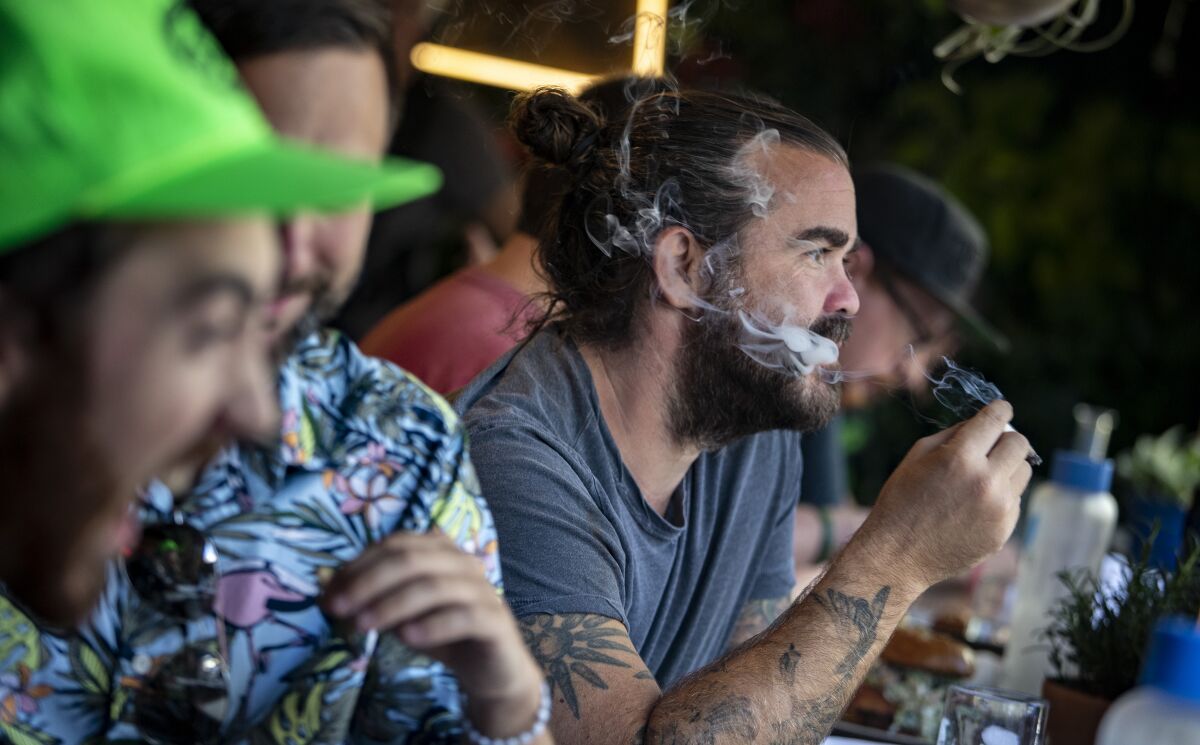 Patrons smoke cannabis at a cafe