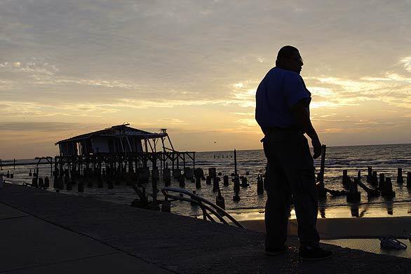 In the aftermath of Hurricane Ike, Michael Segura surveys the damage along the sea wall in Galveston, Texas.
