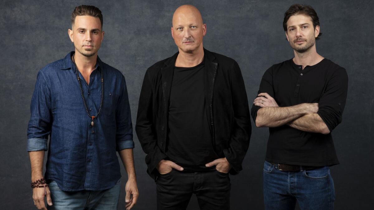 Wade Robson, left, director Dan Reed and James Safechuck from the documentary "Leaving Neverland," which is prompting outrage from Michael Jackson devotees.