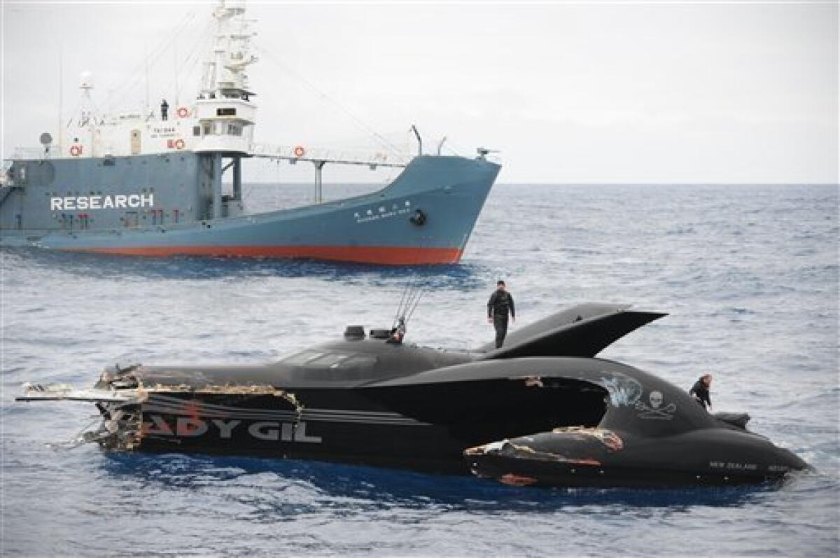 This photo provided by the Sea Shepherd Conservation Society shows the sheared off bow of the Ady Gil, foreground, a high-tech speed boat that resembles a stealth bomber after a collision with a Japanese whaling ship in the frigid waters of Antarctica on Wednesday Jan. 6, 2010. The conservation group said its vessel had its bow sheared off after it was hit by the Shonan Maru, background, near Commonwealth Bay. The clash was the most serious in the past several years, during which the Sea Shepherd has sent vessels into far-southern waters to try to harass the Japanese fleet into ceasing its annual whale hunt. Crew member Laurens De Groot, center, is seen on top of the vessel. (AP Photo/Sea Shepherd Conservation Society, JoAnne McArthur) NO SALES MANDATORY CREDIT