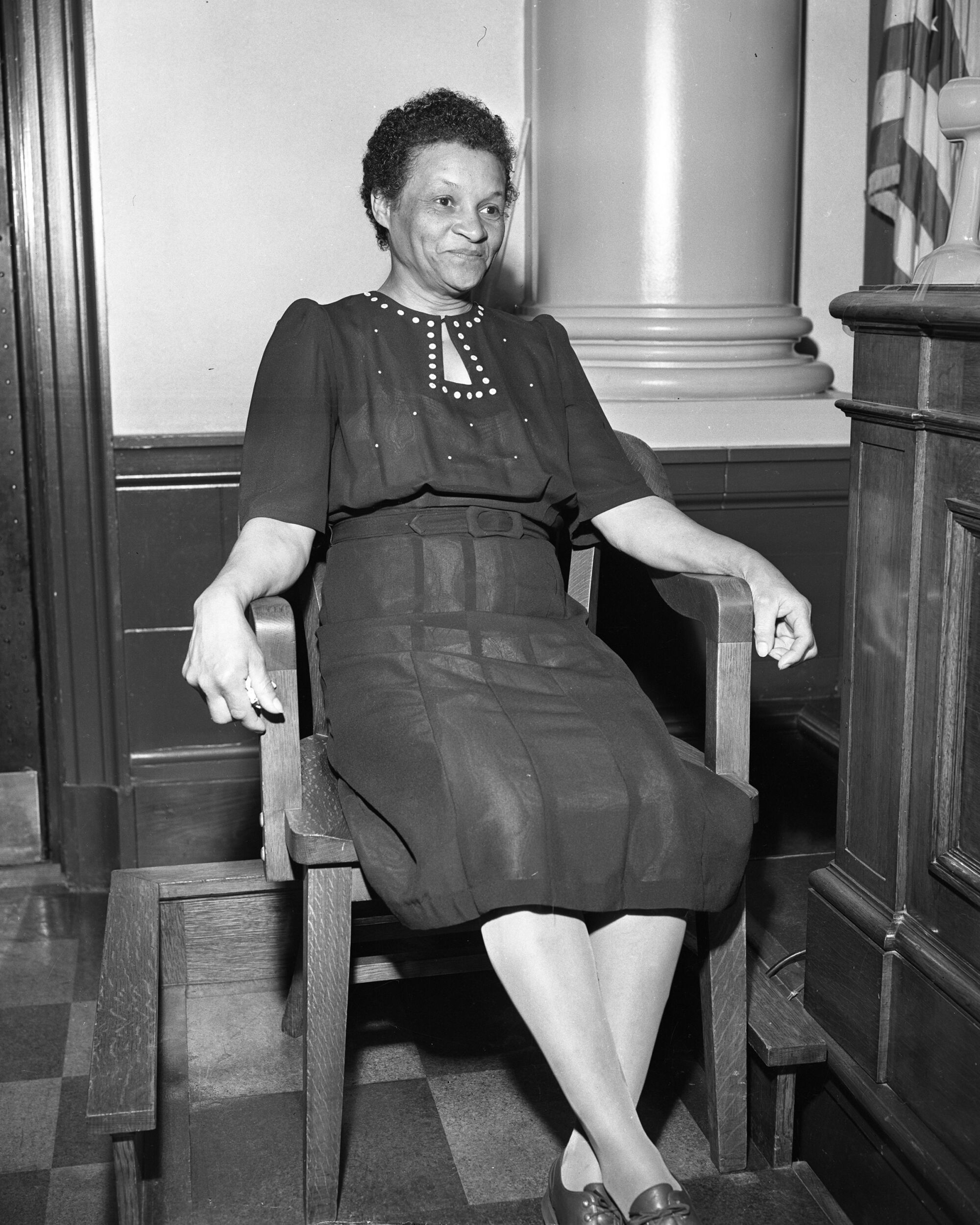 Dora Jones sits on the witness stand in court.