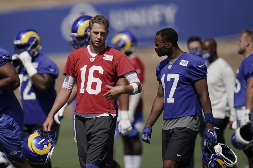 Los Angeles Rams quarterback Jared Goff, left, talks with wide receiver Robert Woods.