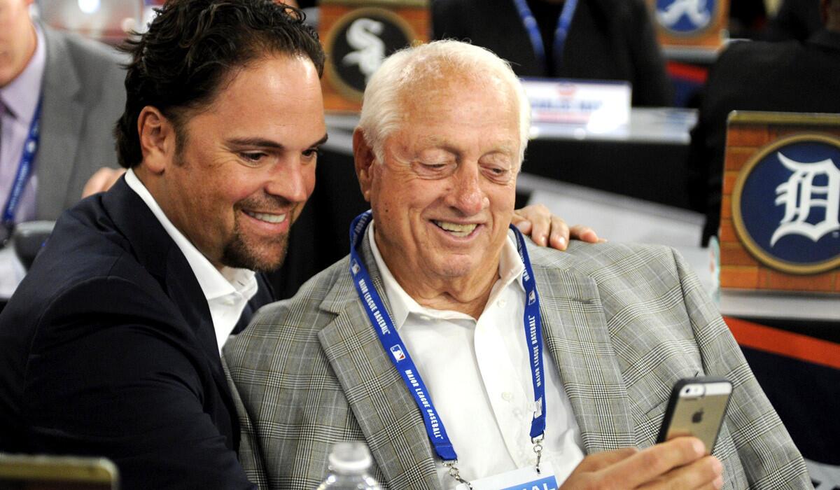 Former Dodgers catcher Mike Piazza, left, and manager Tom Lasorda take a picture before the 2014 amateur draft.