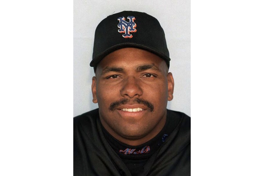 FILE - This is a 1999 file photo showing Bobby Bonilla of the New York Mets baseball team. The New York Mets under new owner Steven Cohen are embracing Bobby Bonilla Day, an annual remembrance of a famously unsuccessful contract. A promotion announced Thursday, July 1, 2021, that allows a fan to book an Airbnb stay for four at Citi Field for $250 that includes use of the team gym and shower. The promotion includes throwing out the ceremonial first pitch before the Mets play Atlanta on July 28. (AP Photo/File)