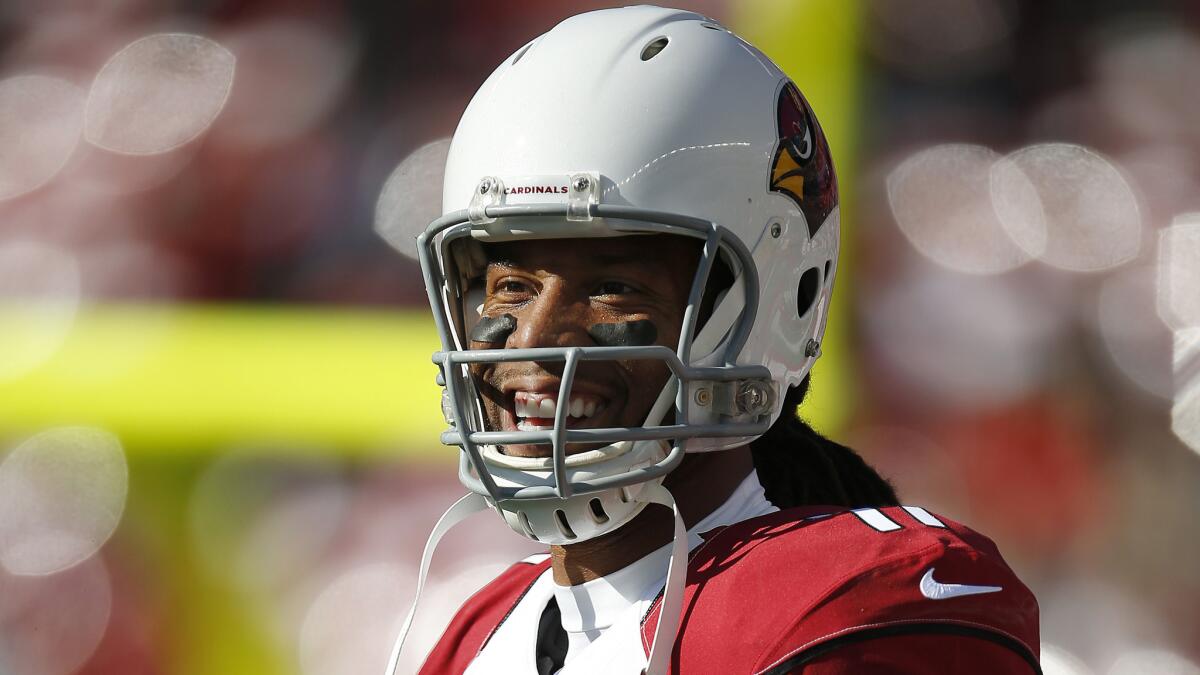 Arizona Cardinals wide receiver Larry Fitzgerald warms up before a game against the San Francisco 49ers on Dec. 28.