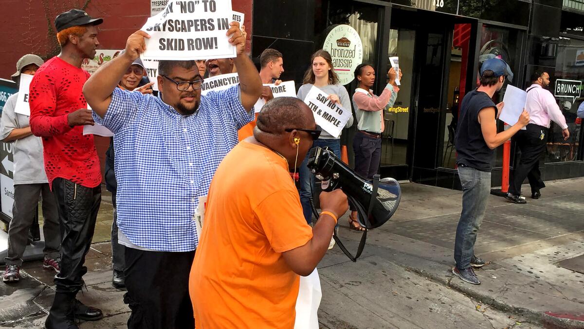 The Los Angeles City Council this year approved a 33-story tower planned by Realm Group in downtown. Protesters warned the project would lead to displacement of low-income renters in the area.