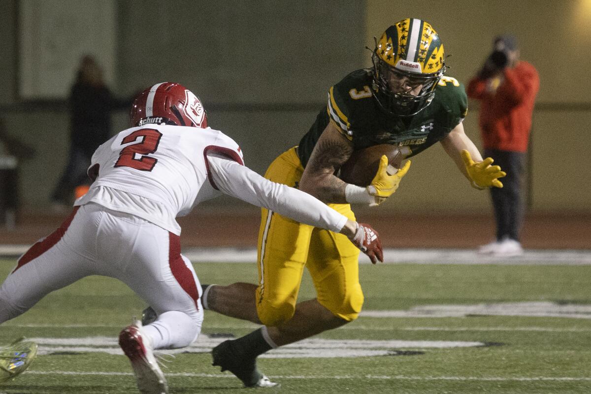Edison's Ashton Hurley runs the ball for a large gain against Orange Lutheran during Friday's game.