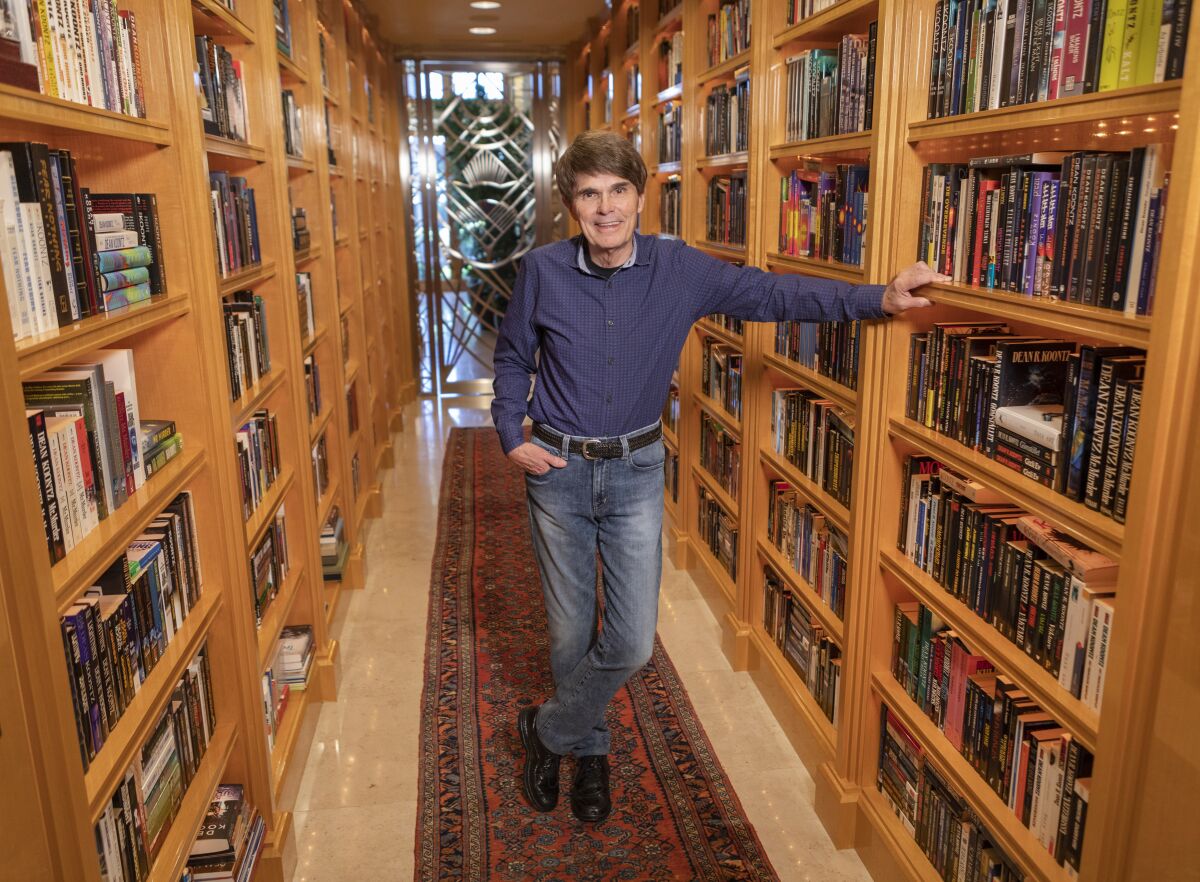 This image released by Thomas & Mercer shows author Dean Koontz, who is out with his 78th book called “Elsewhere,” about a father and his young daughter who get the ability to time hop to parallel universes. (Douglas Sonders/Thomas & Mercer via AP)