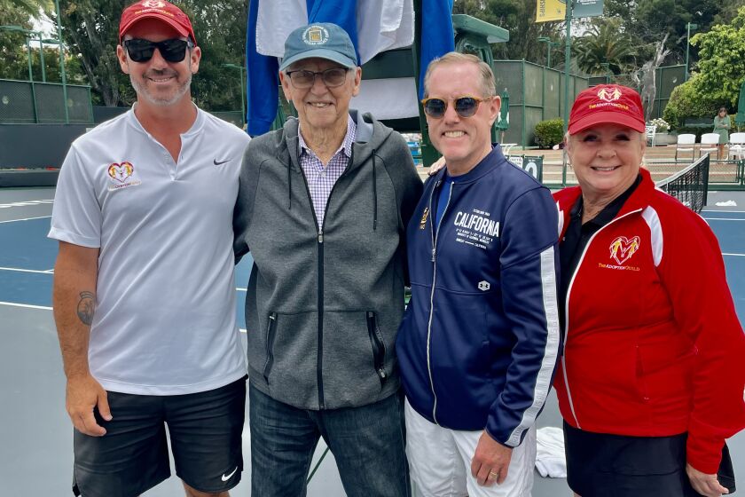 Drew Arbeiter, tennis legend Roy Emerson, Eric Davidson and Adoption Guild president Chris Garber.