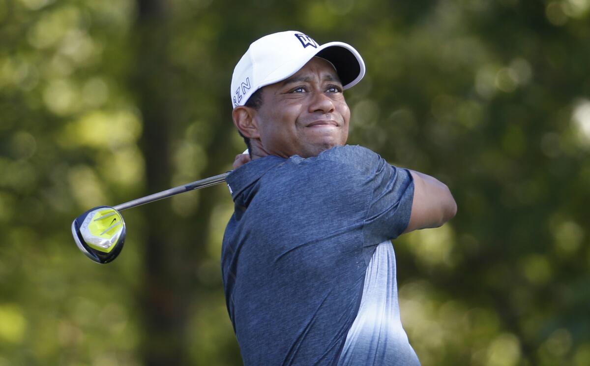 Tiger Woods watches his tee shot during the Quicken Loans National on July 31, 2015.