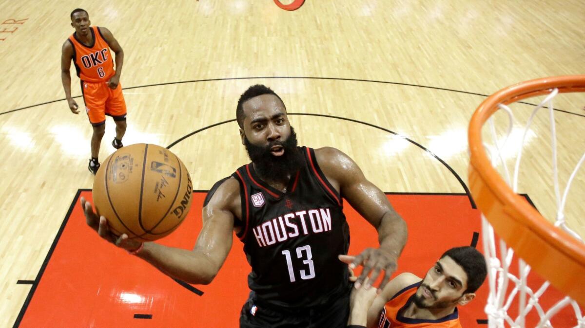 Houston Rockets' James Harden (13) goes up for a shot during the NBA playoffs on April 16. (David J. Phillip / Associated Press)
