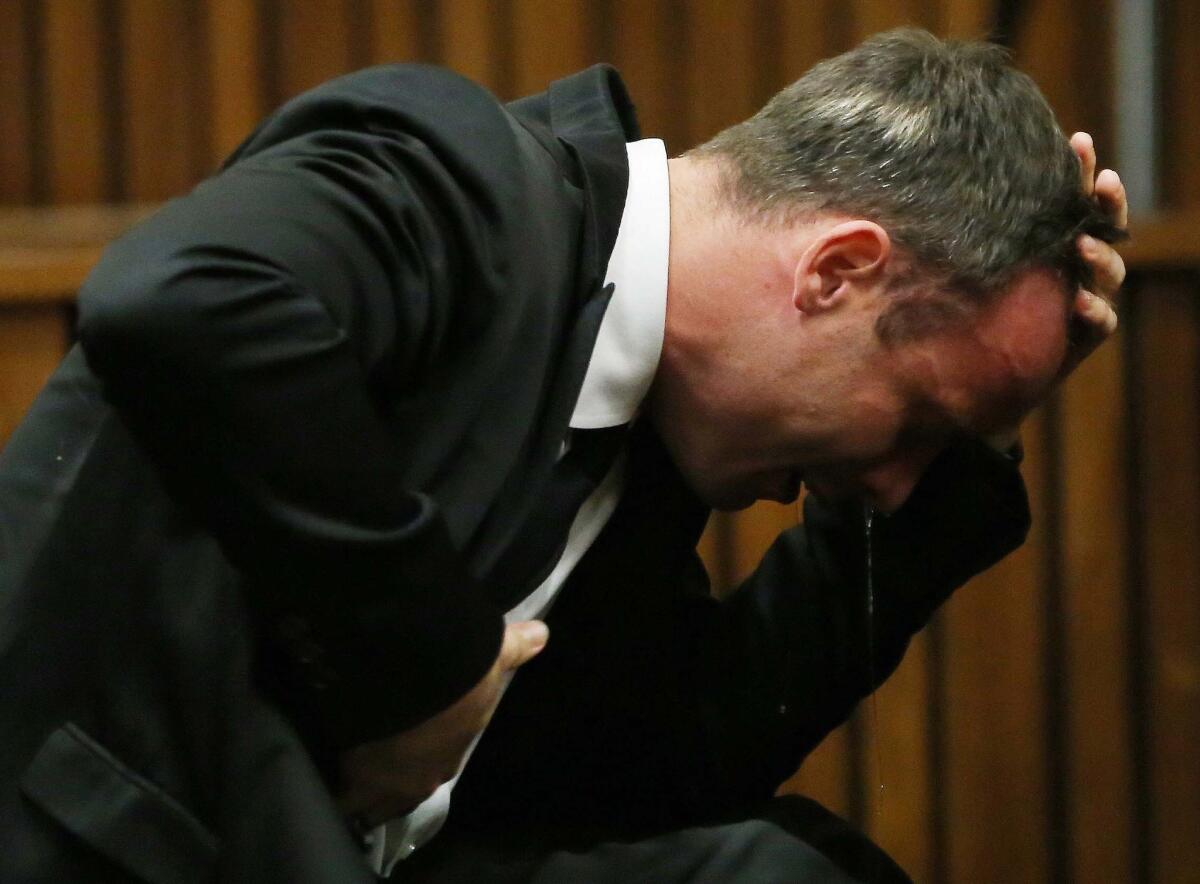 Oscar Pistorius weeps as he listens to evidence by a pathologist in court in Pretoria, South Africa.