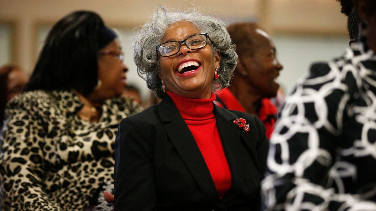 Joyce Holloway laughs during a sermon at a 16th Street Baptist Church service on Dec. 10 in Birmingham, Ala. Pastor Arthur Price told the mostly black congregation that Alabama's U.S. Senate election was too important to skip.