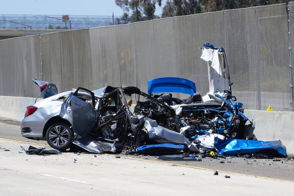 Remains of two destroyed cars near center median on I-5