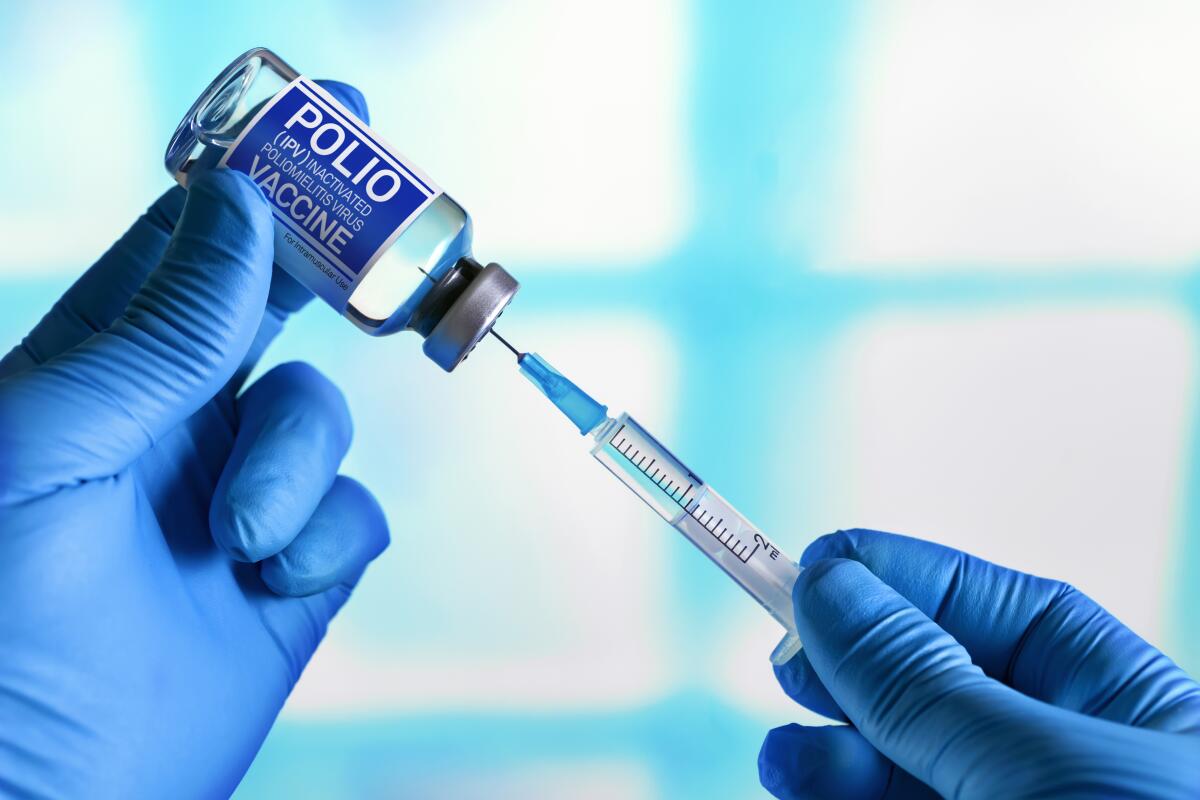Polio vaccine and syringe
