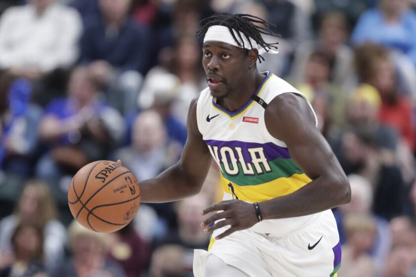 New Orleans Pelicans guard Jrue Holiday (11) plays against the Indiana Pacers during the first half of an NBA basketball game in Indianapolis, Friday, Feb. 22, 2019. (AP Photo/Michael Conroy)