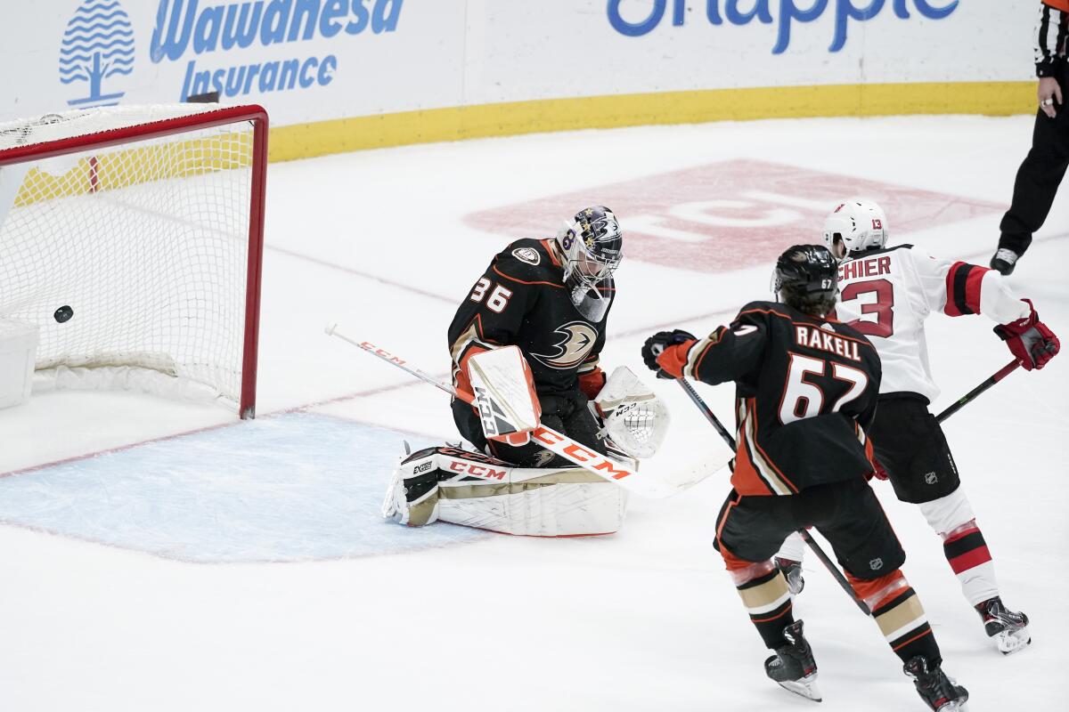 Devils center Nico Hischier (13) scores past Ducks goaltender John Gibson during the third period of the Ducks' 3-0 loss at Honda Center on Sunday.