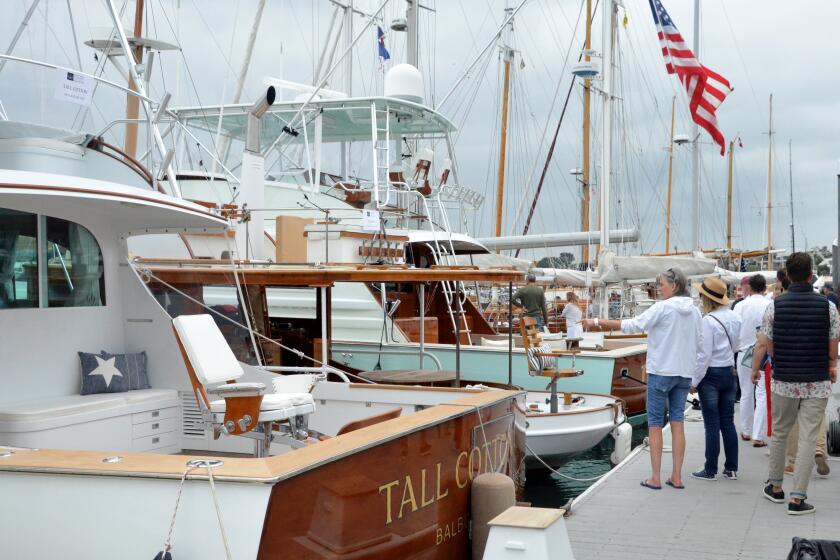 Boat aficionados strolled the docks during the Newport Beach Wooden Boat Festival.