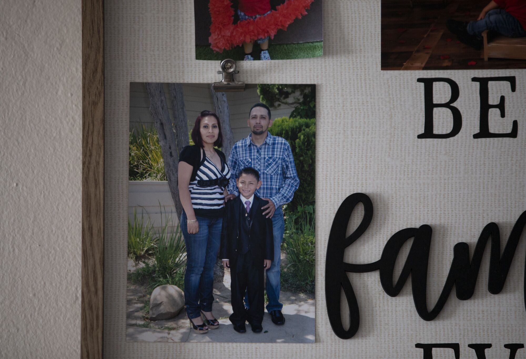 Family photos hang in the kitchen of Patricia Osorio's home.