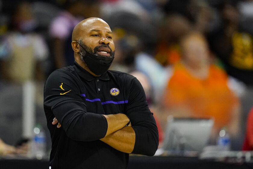 Los Angeles Sparks head coach Derek Fisher on the bench in the first half of a WNBA basketball game against the Indiana Fever in Indianapolis, Tuesday, Aug. 31, 2021. (AP Photo/Michael Conroy)