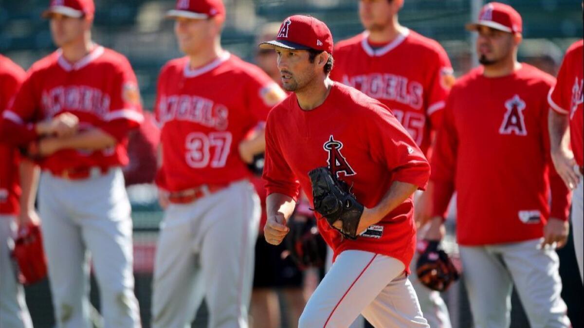 Angels closer Huston Street runs out to the mound for an infield drill during spring training at Tempe Diablo Stadium on Feb. 24.