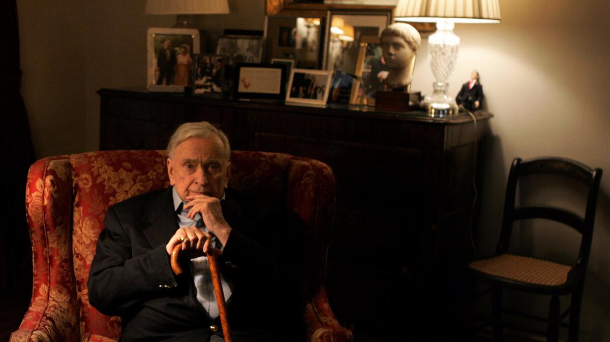 Writer Gore Vidal reclines in his Hollywood Hills home in 2006. Hundreds of items from his estate will be auctioned on Sept. 18 by Abell Auction Co.