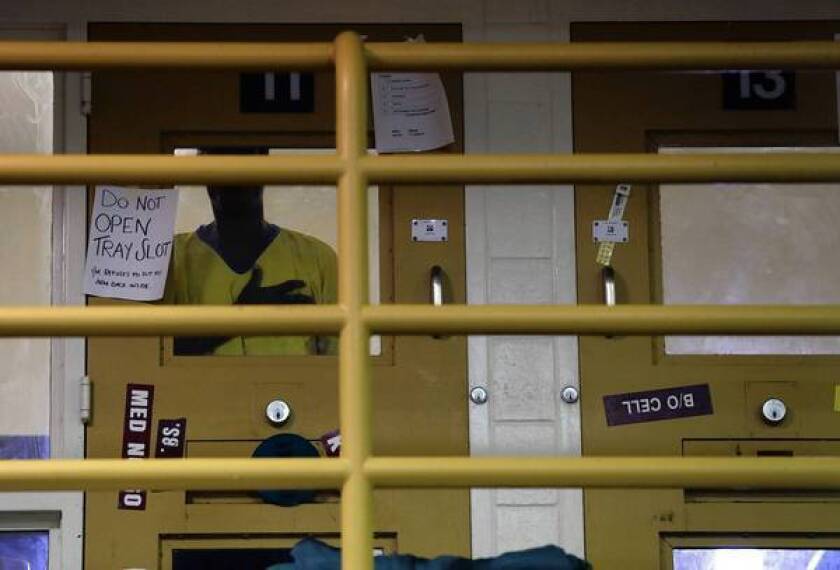 An inmate stands in his cell in an observation area at the Twin Towers facility. The Los Angeles County Jail houses about 3,200 people with mental illness.