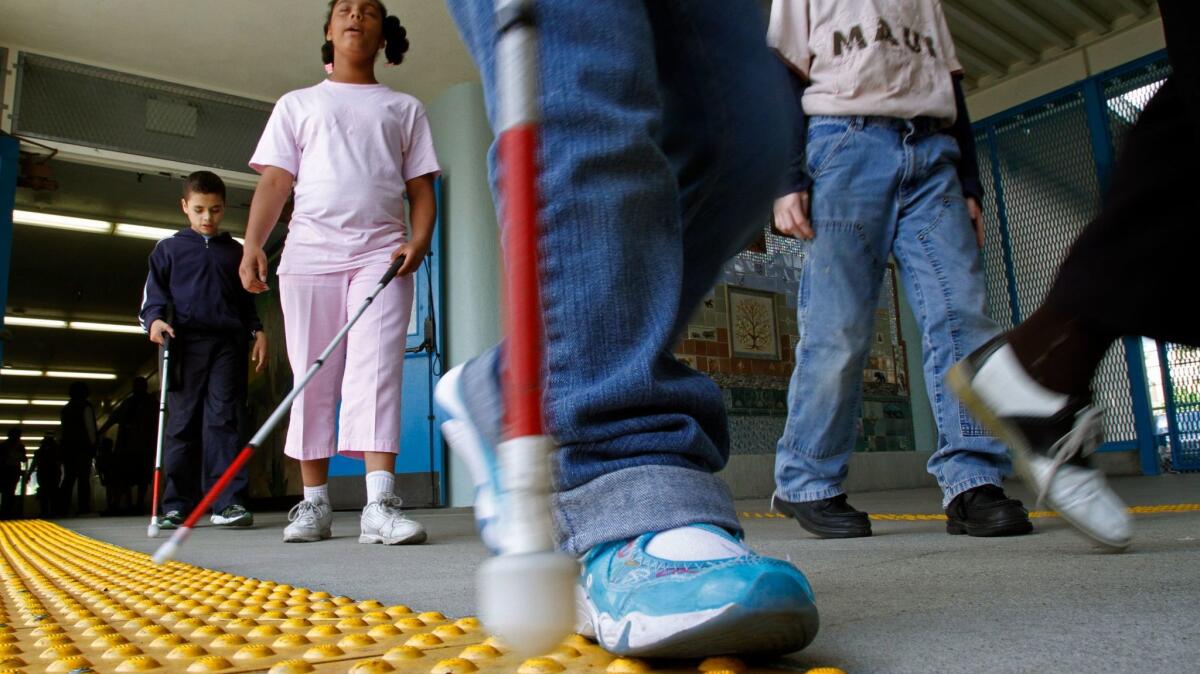 It's uncertain whether disabled children will fare better under newly changed operating rules for charters in L.A. Unified, which serves many children with expensive needs. In this Hollywood program for blind students with other disabilities, "bumpy tile" helps them navigate.