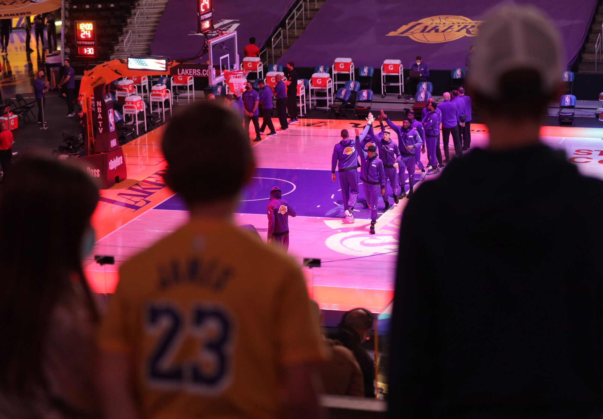 Fans and players stand for the national anthem before the Lakers-Celtics game.