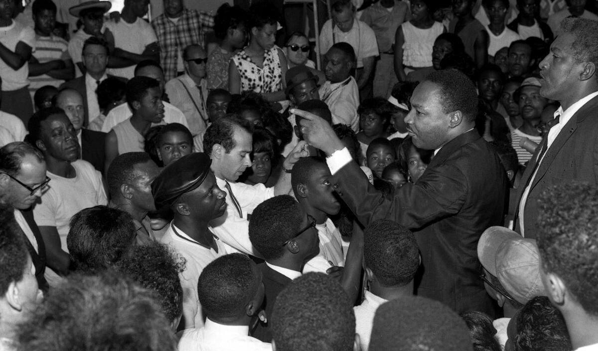 Martin Luther King Jr. speaks at a Westminster Neighborhood Assn. gathering on Aug. 18, 1965, during what became known as the Watts riots.