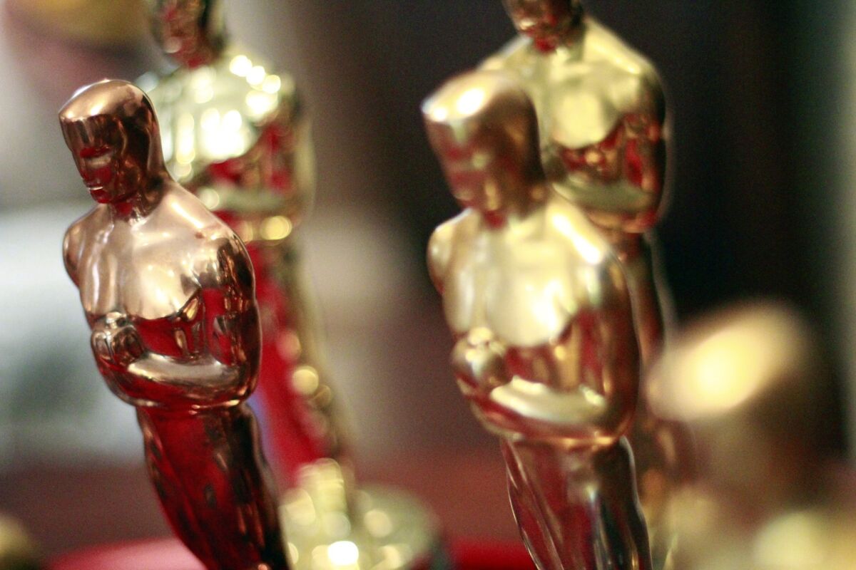 Four Oscar statuettes are pictured for the Academy Awards