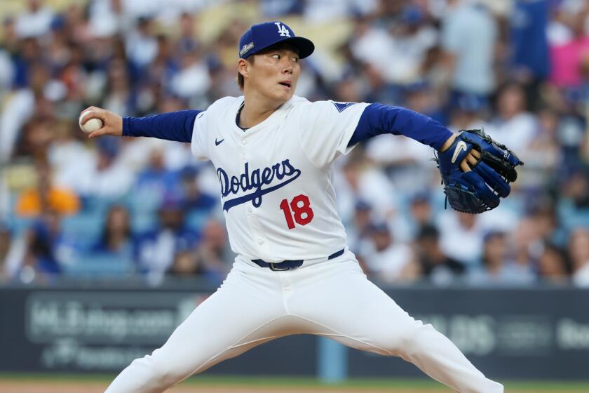 LOS ANGELES, CALIFORNIA - OCTOBER 05: Yoshinobu Yamamoto #18 of the Los Angeles Dodgers.