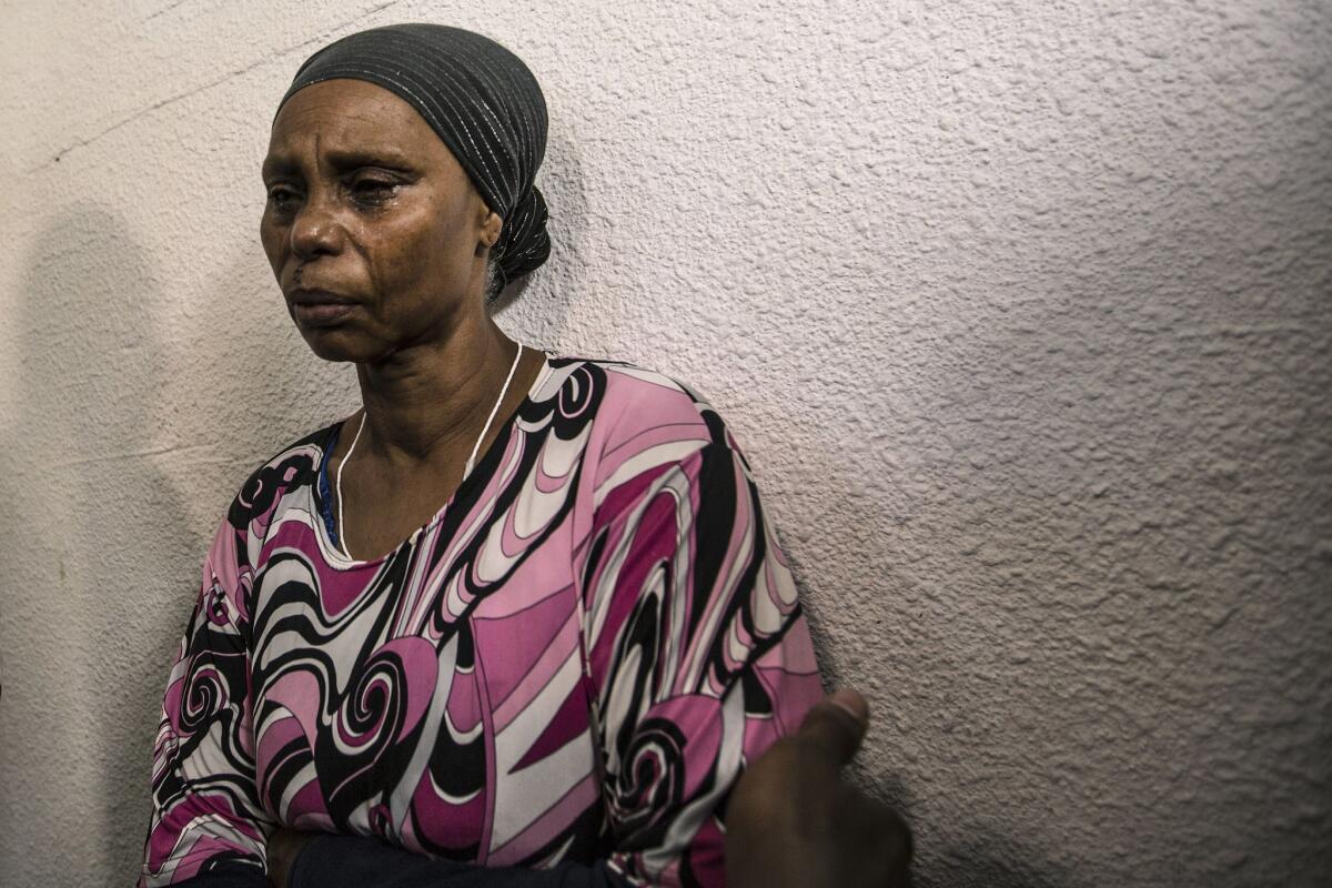 The mother of Avraham Avera Mengistou, a missing Ethiopian Israeli, weaps after a family news conference in the coastal city of Ashkelon on July 9.