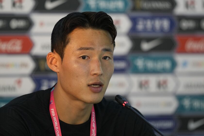 FILE - South Korea's Son Jun-ho speaks during a press conference before a training session at Al Egla Training Site 5 in Doha, Qatar, Nov. 22, 2022. South Korean national soccer team midfielder Son has been detained in the northeastern Chinese province of Liaoning on suspicion of accepting a bribe, China's Foreign Ministry said Tuesday, May 16, 2023. (AP Photo/Lee Jin-man, File)